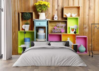 Beautiful colorful shelves with different home related objects Wall mural