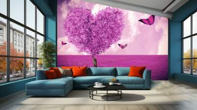 Beautiful field with heart shape tree and butterflies. Abstract pink landscape background. Wall mural