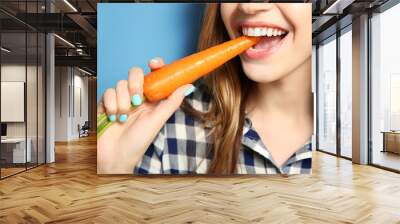 beautiful girl eat carrot, closeup Wall mural