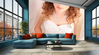 Beautiful woman with in  wedding dress over blue studio backgrou Wall mural