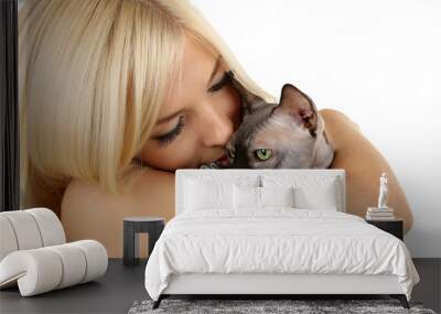 Beautiful young woman holding gray sphinx cat isolated on white Wall mural