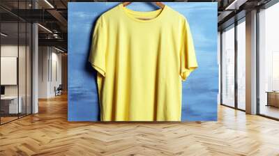 Blank yellow t-shirt against grunge background Wall mural