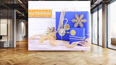 Blue holiday gift boxes and ribbon Wall mural