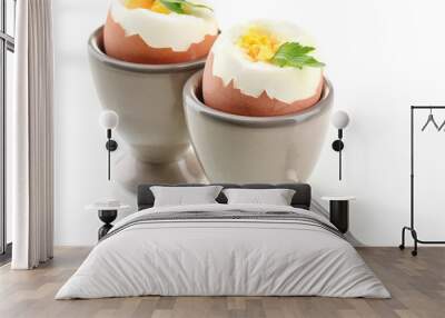 Boiled eggs in egg cup, isolated on white Wall mural