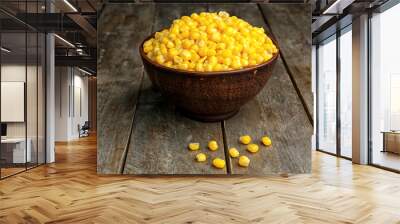 Bowl with corn seeds on wooden background Wall mural