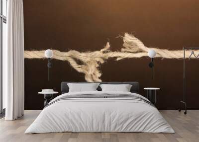 Breaking rope on brown background Wall mural