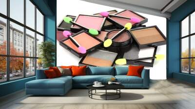 Bright eye shadows and sponge brushes for foundation isolated Wall mural