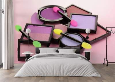 Bright eye shadows and sponge brushes for foundation Wall mural