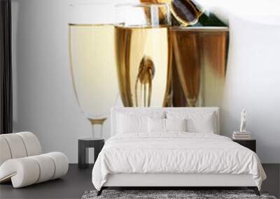 Champagne bottle in bucket with ice and glasses of champagne, Wall mural