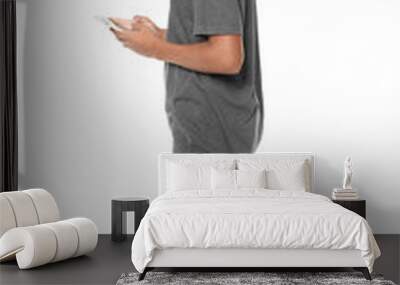 Charming African-American teenager with smartphone on white background Wall mural