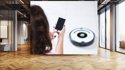 Cleaning concept - automatic robotic hoover clean the room, close up Wall mural