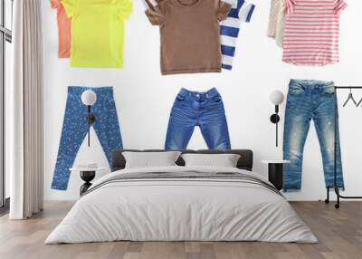 Collage of different children clothes isolated on white Wall mural