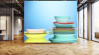 Color plates on blue background Wall mural