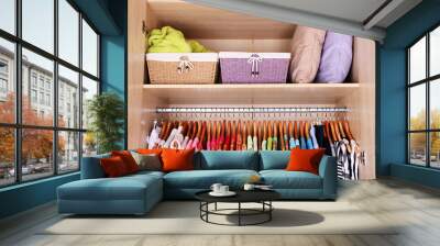 colorful clothes hanging in wardrobe Wall mural