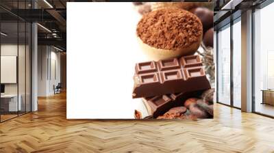 Composition of chocolate sweets, cocoa and spices, isolated Wall mural