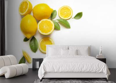 Composition of delicious citrus fruit and green leaves on white background Wall mural