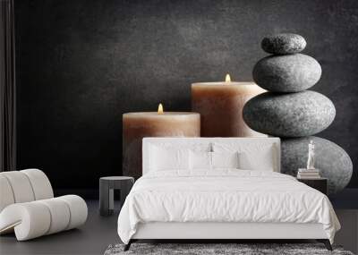 Composition of spa pebbles and candles on grey background Wall mural