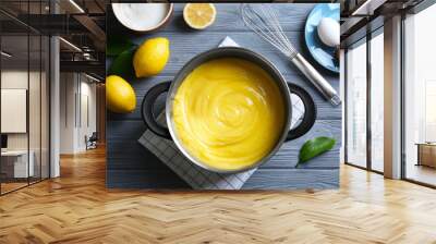 Composition with delicious lemon curd and ingredients on wooden table Wall mural