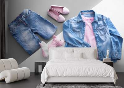 Composition with fashionable children clothes on color background Wall mural