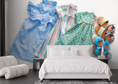 Composition with fashionable children clothes on white background Wall mural