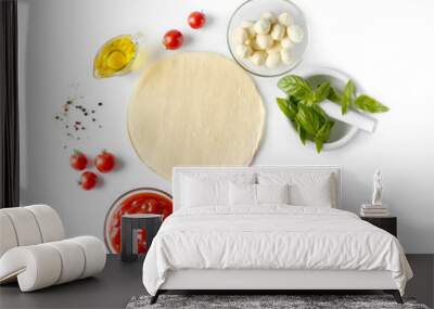 Composition with green fresh organic basil and ingredients for pizza isolated on white Wall mural