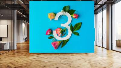 Composition with number 3 and beautiful flowers on color background Wall mural