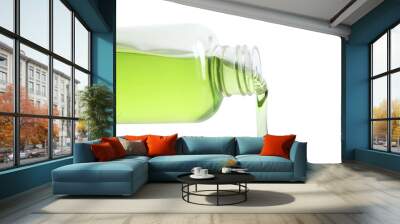 Cosmetic liquid pouring from bottle isolated on white Wall mural