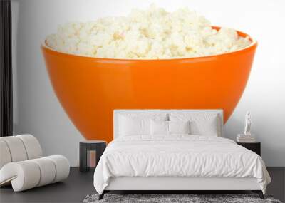 cottage cheese in orange bowl isolated on white Wall mural