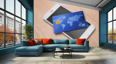 Credit card and mobile phone on table. Internet shopping concept Wall mural