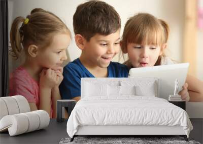 Cute kids using digital tablet Wall mural