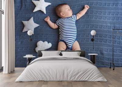 Cute little baby sleeping on bed Wall mural