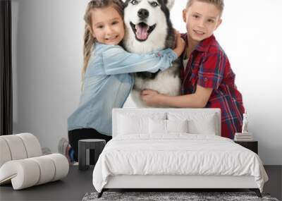 Cute little children with Husky dog on white background Wall mural