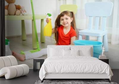 Cute little girl cleaning her room Wall mural