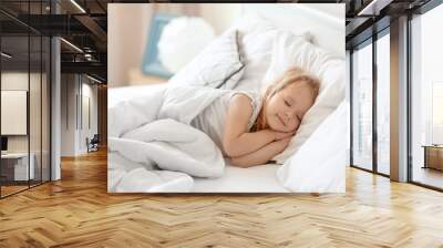 Cute little girl sleeping on bed with soft pillows at home Wall mural