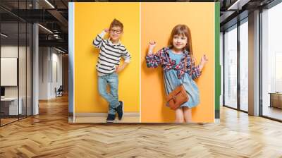 Cute stylish boy near color wall Wall mural