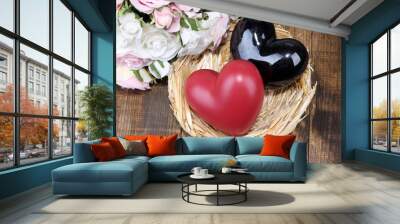 Decorative hearts in nest, on color wooden background Wall mural