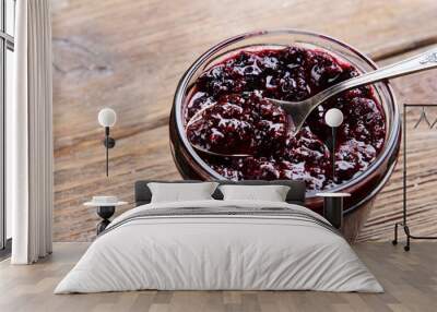 Delicious black currant jam on table close-up Wall mural