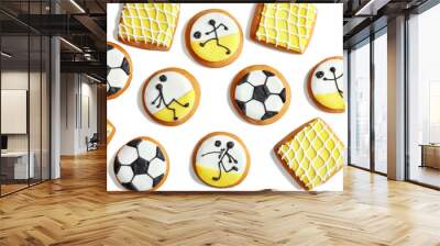 Delicious gingerbread cookies decorated with football signs on white background Wall mural