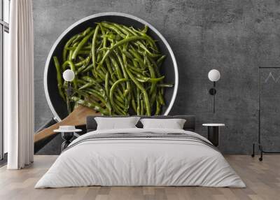 Delicious green beans in frying pan on grey background Wall mural