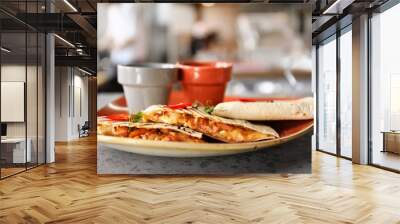 Delicious quesadillas with sauces on plate Wall mural