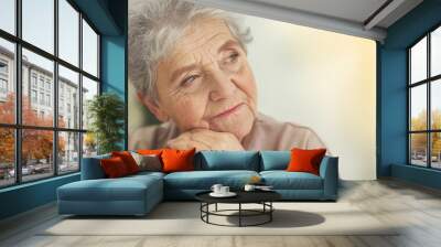 Depressed elderly woman at home Wall mural