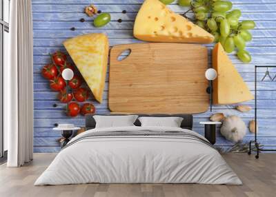 Different Italian cheese on wooden table Wall mural