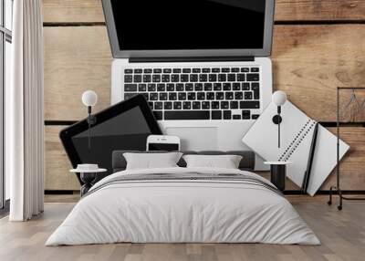 Different modern devices with notebook and pen on wooden table Wall mural