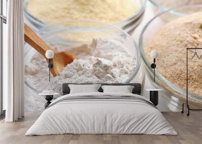 Different types of flour in bowls close up Wall mural