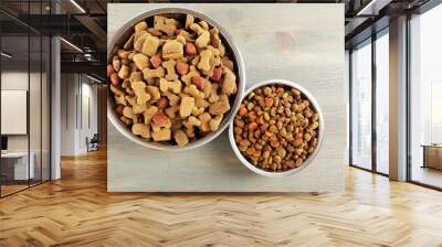 Dog food in bowls on wooden table Wall mural