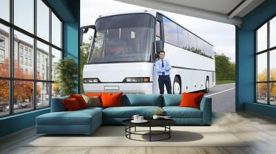 Driver standing in front of bus Wall mural