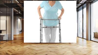 Elderly woman with walking frame on white background Wall mural