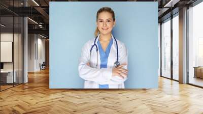 Female doctor with stethoscope on color background Wall mural