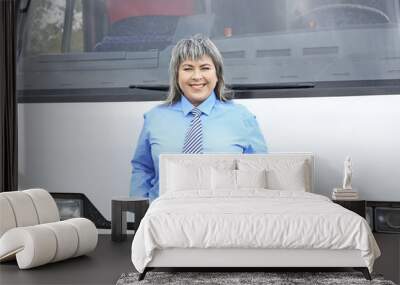 Female driver standing in front of bus Wall mural