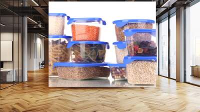 Filled plastic containers isolated on white Wall mural